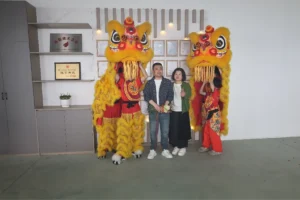 GLORY MACHINERY team with lion dancers at the 2026 Foshan grand opening