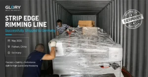 Industrial strip edge rimming line being loaded and secured inside a shipping container for export to Germany