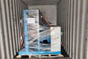 12-head automatic oscillating traverse winder secured for export shipment